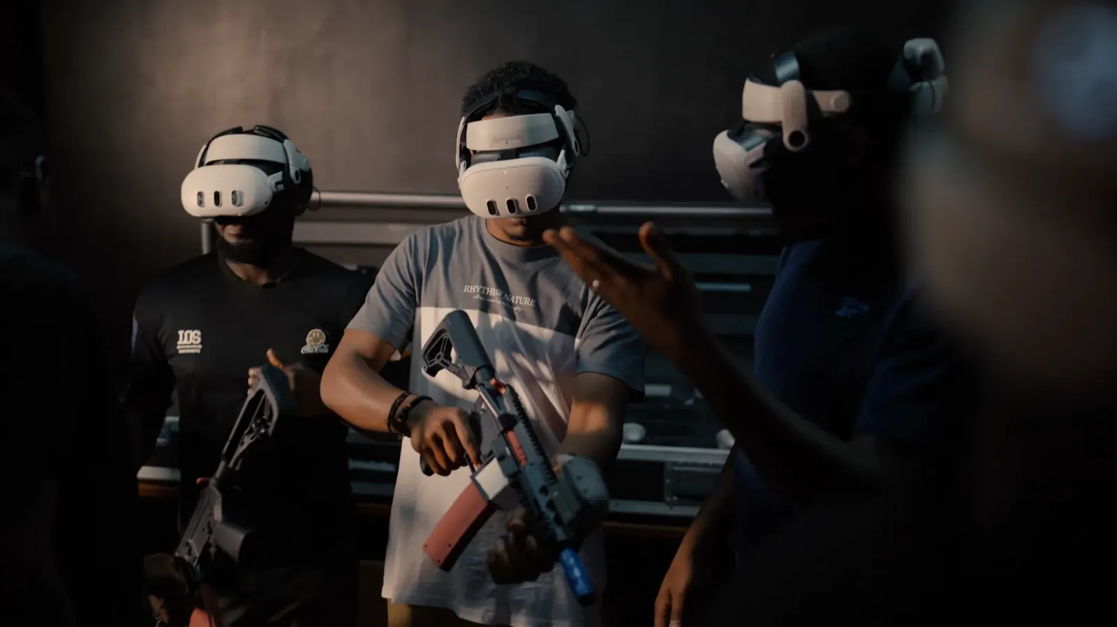 Operator wearing a VR headset and holding a rifle inside a Combatica arena