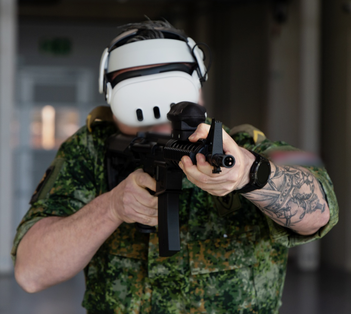 Operator in tactical gear with VR headset and rifle